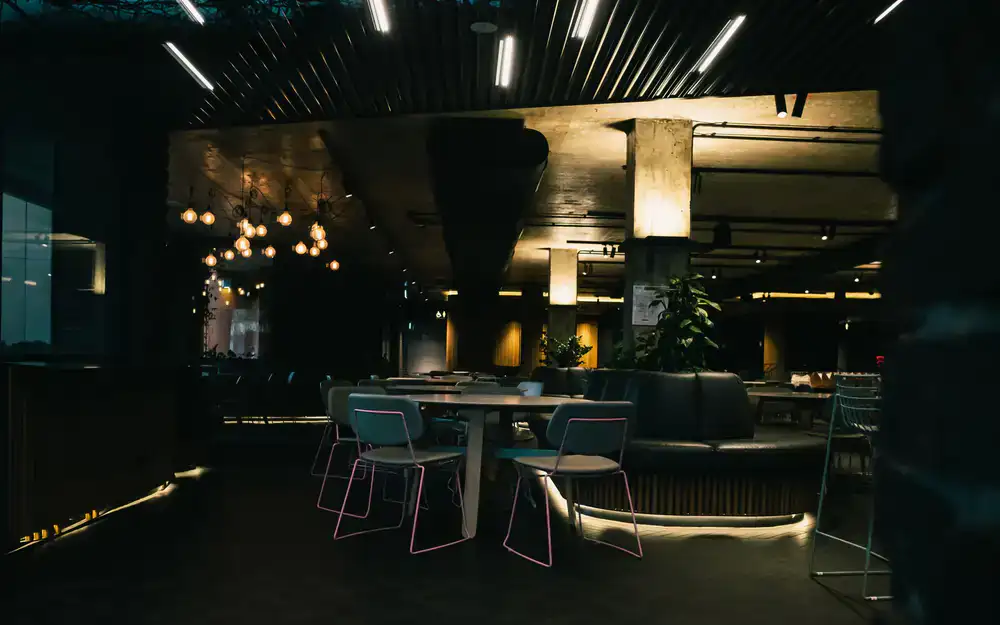 Modern dark lounge area at Hyperreal Arena