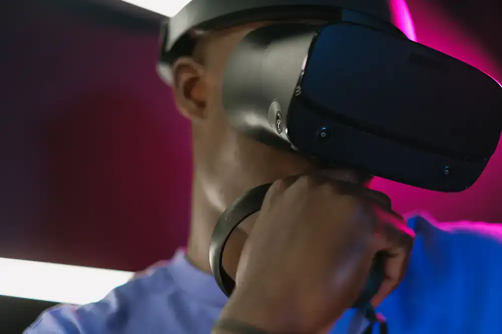 Person wearing a VR headset preparing to enter the arena